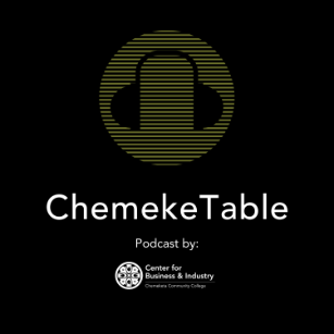 Logo for the ChemekeTable podcast. Narrowly divided green lines with the black outline of over-ear headphones inside. Below are the words 