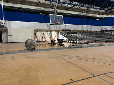 Gymnasium bleachers in the process of being constructed.