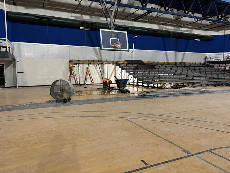 Gymnasium bleachers in the process of being constructed.
