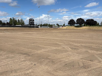 The location of the soccer field plowed and levels for the installation of the turf field and stormwater detention system