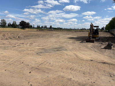 The location of the soccer field plowed and levels for the installation of the turf field and stormwater detention system